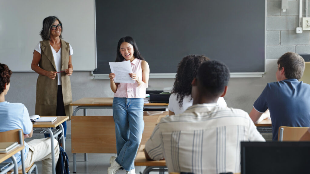 High school student club leadership talks in a class meeting