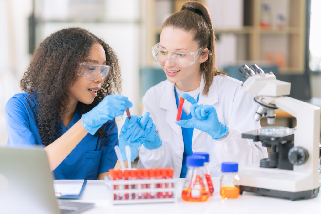 Students working in a medical research laboratory examining blood samples