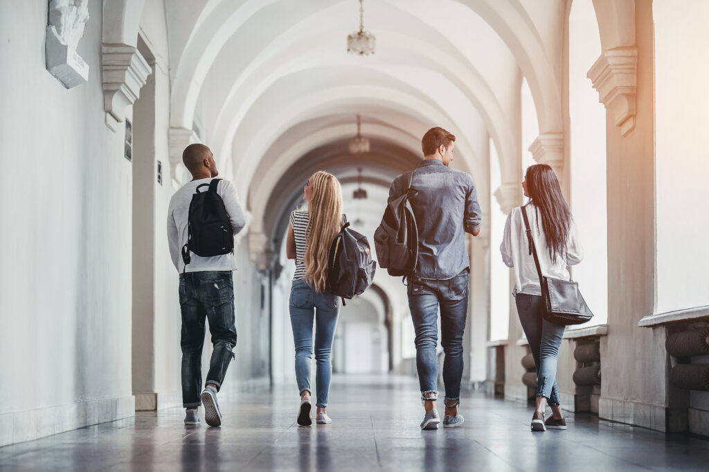 Students on a university tour and campus visit consider admissions