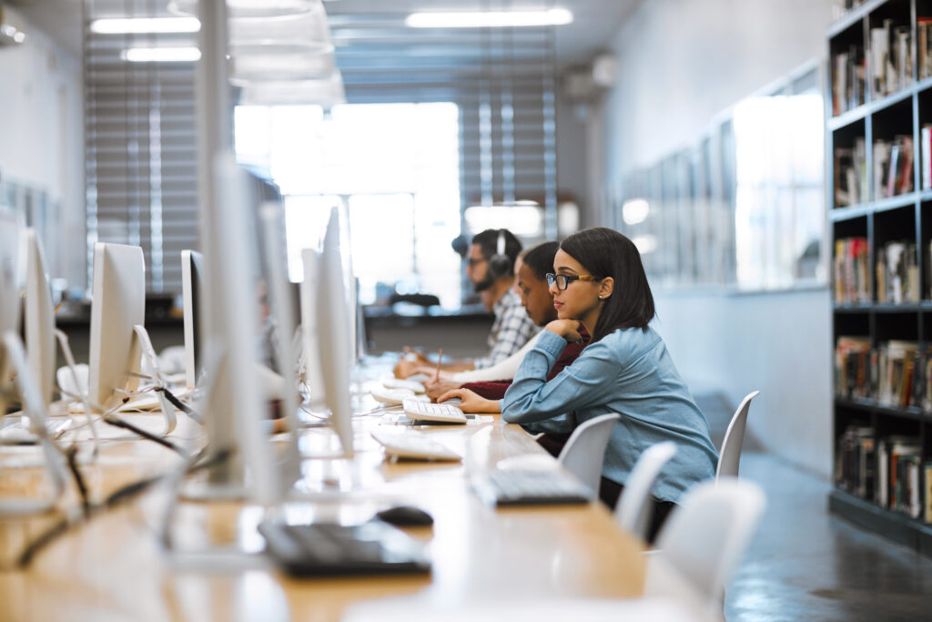 Students working in a computer lab during a college admissions event