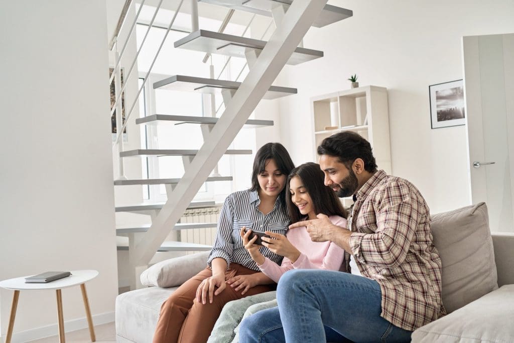 family using phone together