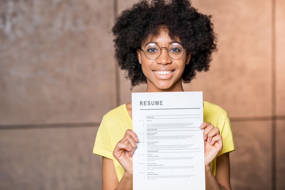 Young internship candidate shows student resume